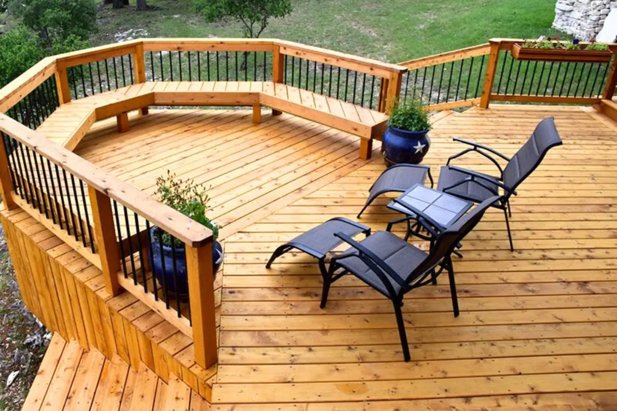 custom wooden deck with 2 chairs