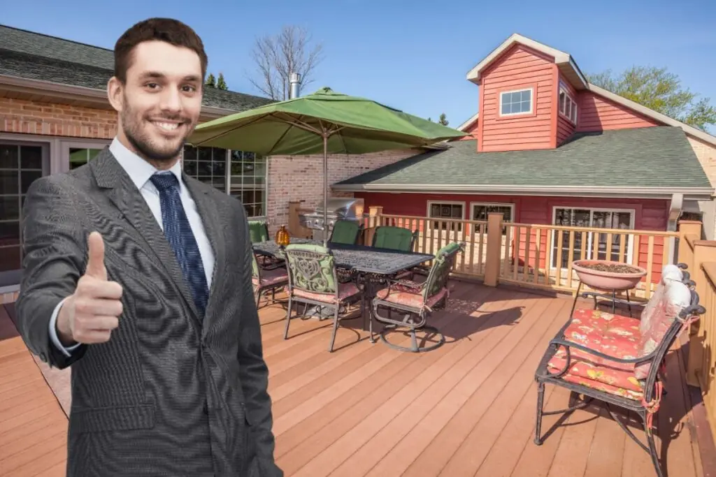 home owner standing in front of outdoor deck