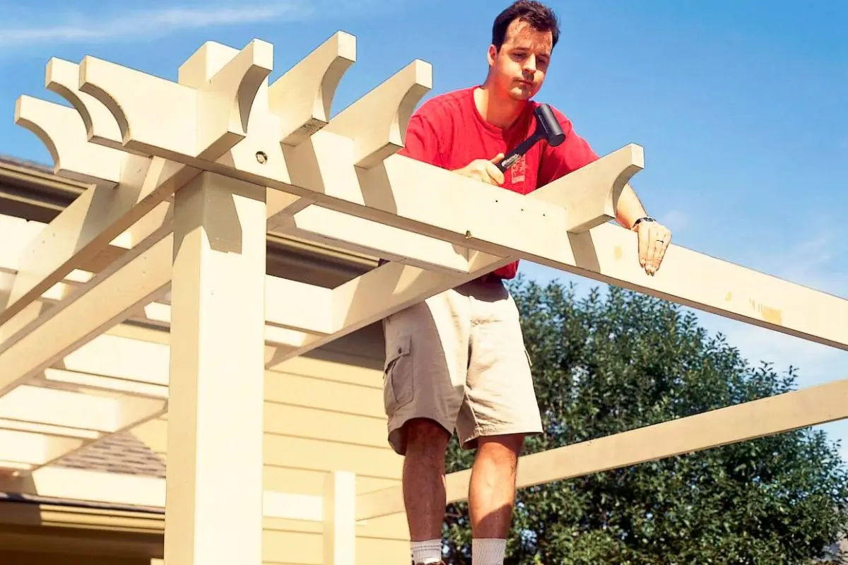 a man building wood pergolas