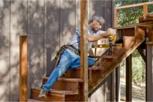 deck contractor installing deck stair