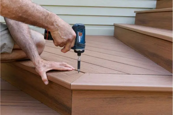 deck worker installing deck stair