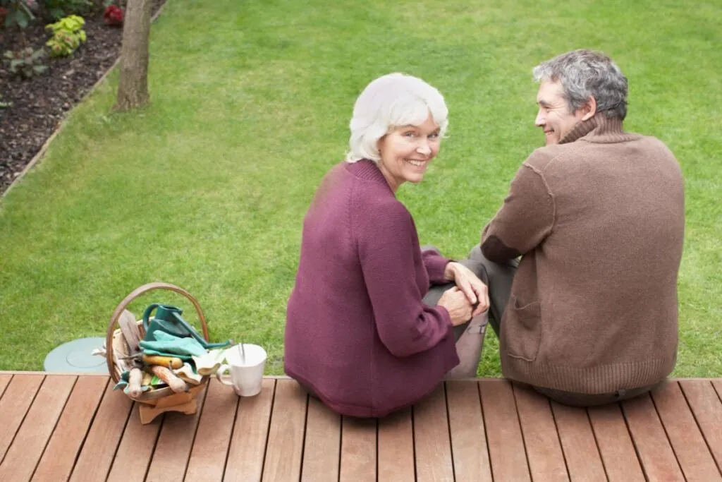 couple sitting on backyard deck