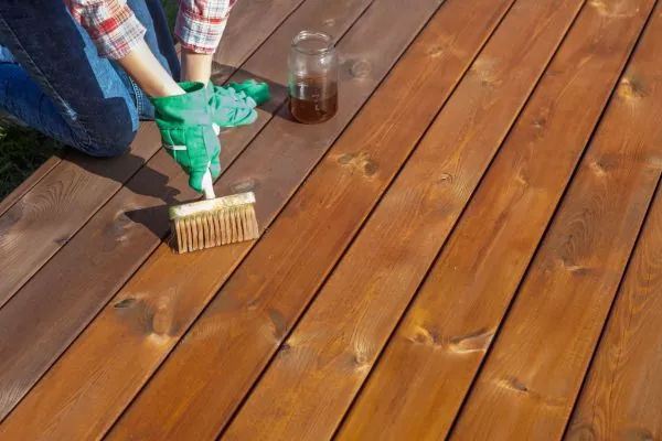 deck builder staining ground level deck boards