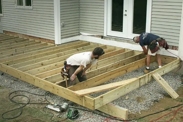 deck contractor working on deck board replacement